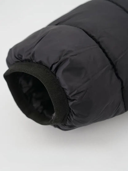 Black winter down jacket sleeve with waterproof and breathable fabric.